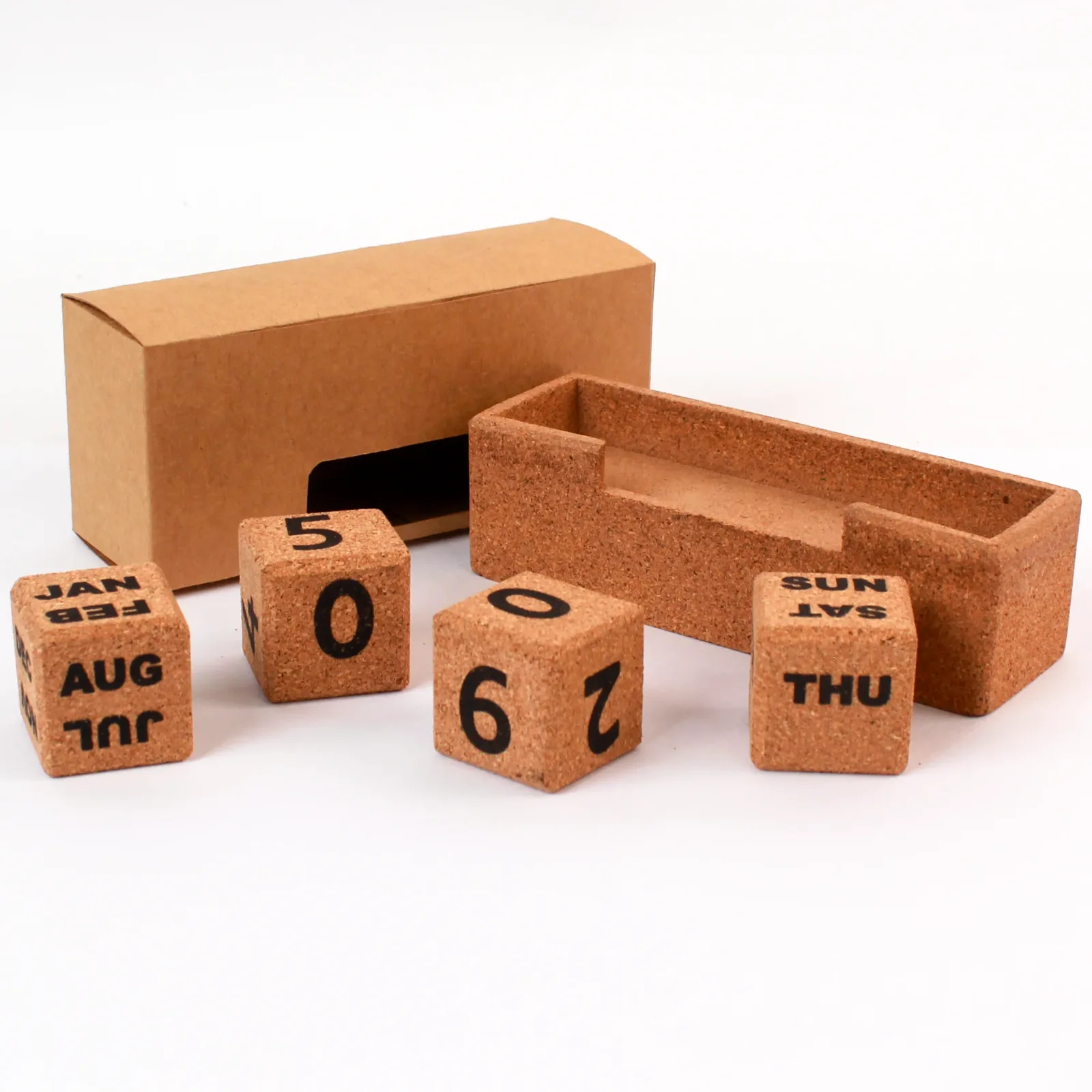 Slim cork calendar blocks and holder photographed beside a plain brown box