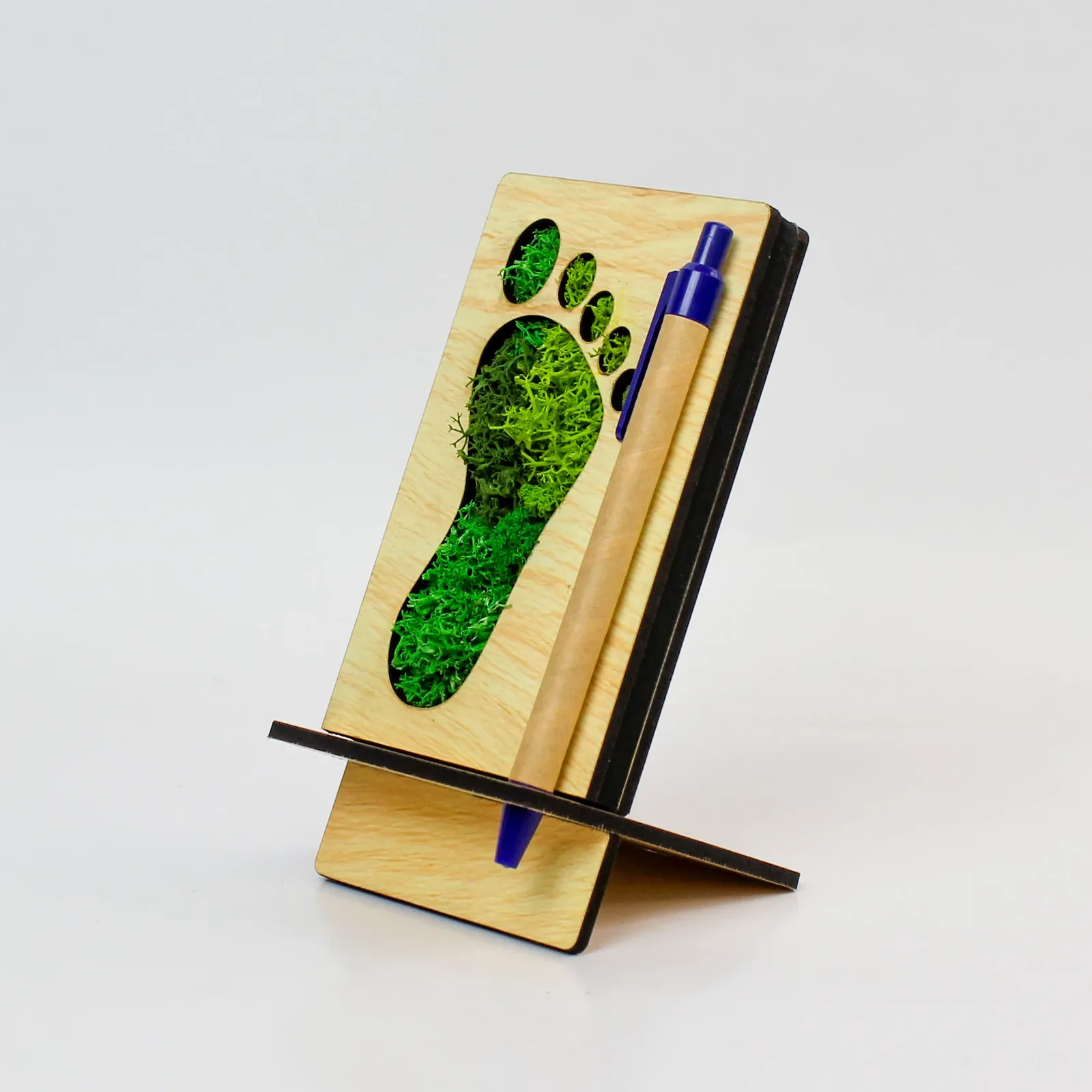Angled view of the Footprint Forest Pen Stand showing the side pen slot and rear support
