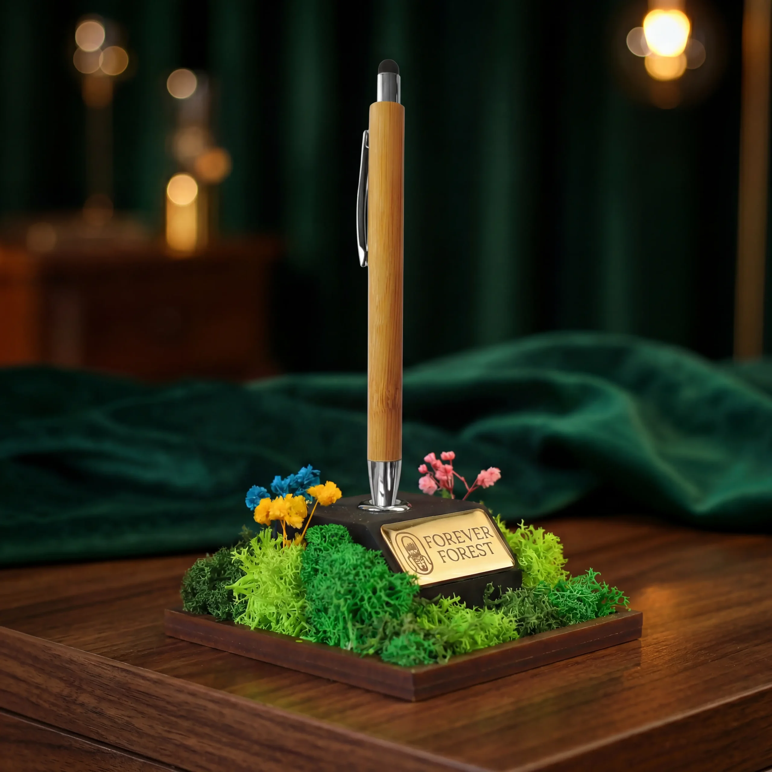 The Forest Quill pen stand on a dark wooden table, green velvet behind it